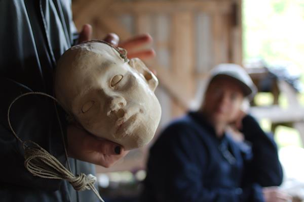 A head sculpted in wood 